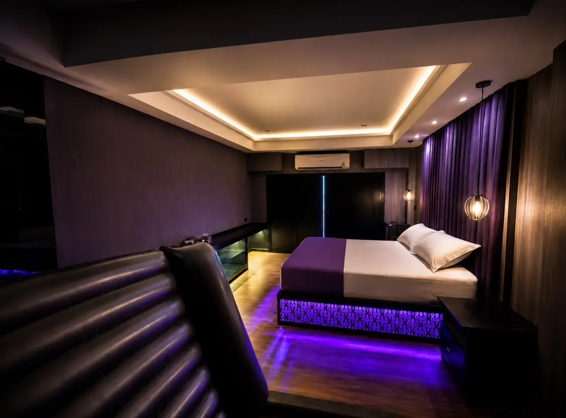 Room with a king-size bed and a mattress laid out on the floor